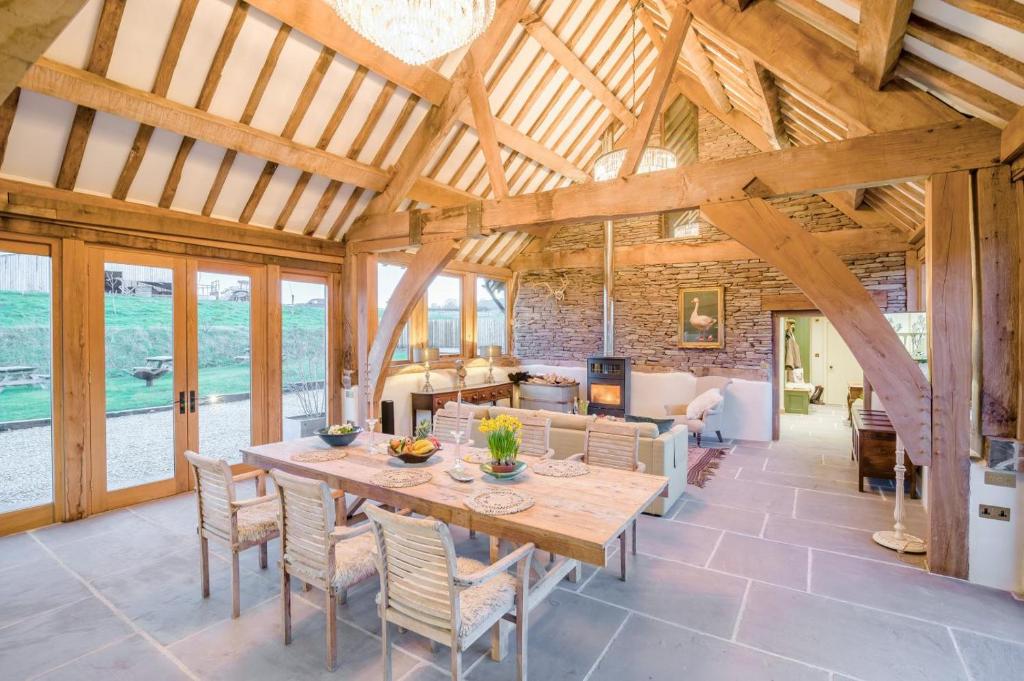 a dining room and living room with a table and chairs at 3 Bed in Dulas oc-g34082 in Longtown
