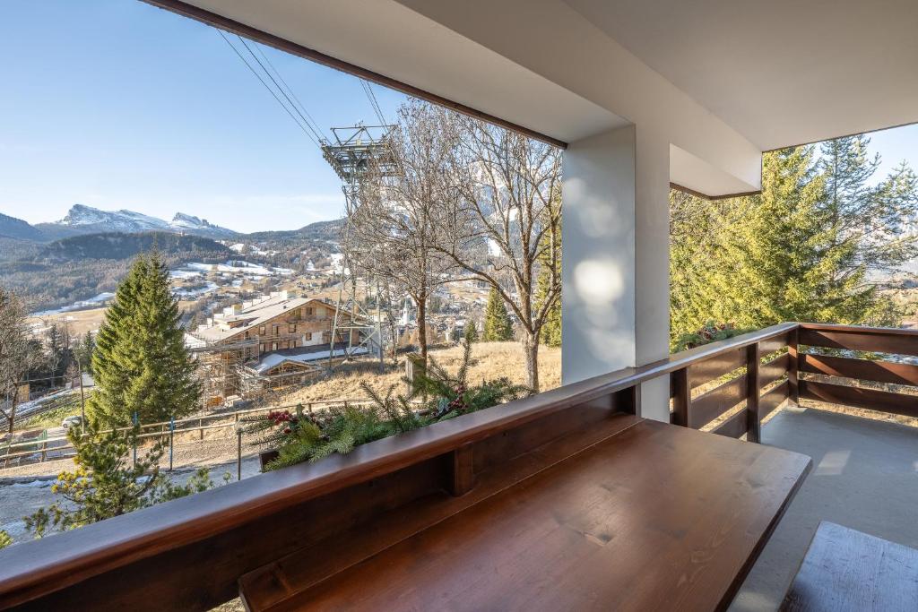 a balcony with a view of the mountains at Chalet Capriol by My Villa Collection in Cortina dʼAmpezzo