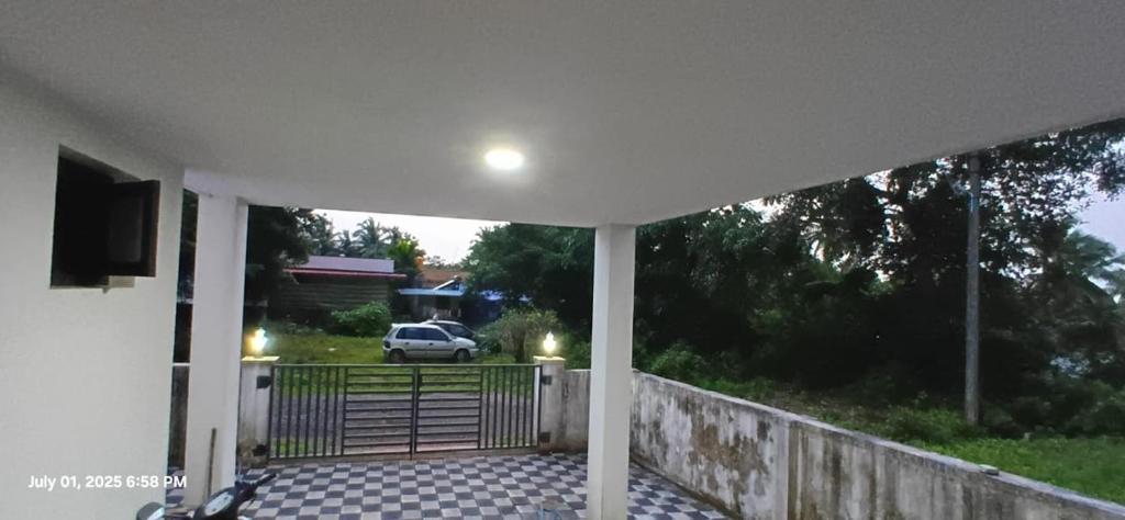 a car is parked on a porch in a house at Golden in Kaup