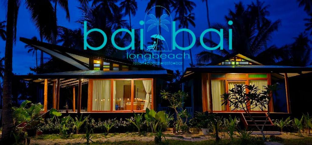 a building with a neon sign in front of it at BAIBAI Long Beach in New Agutaya