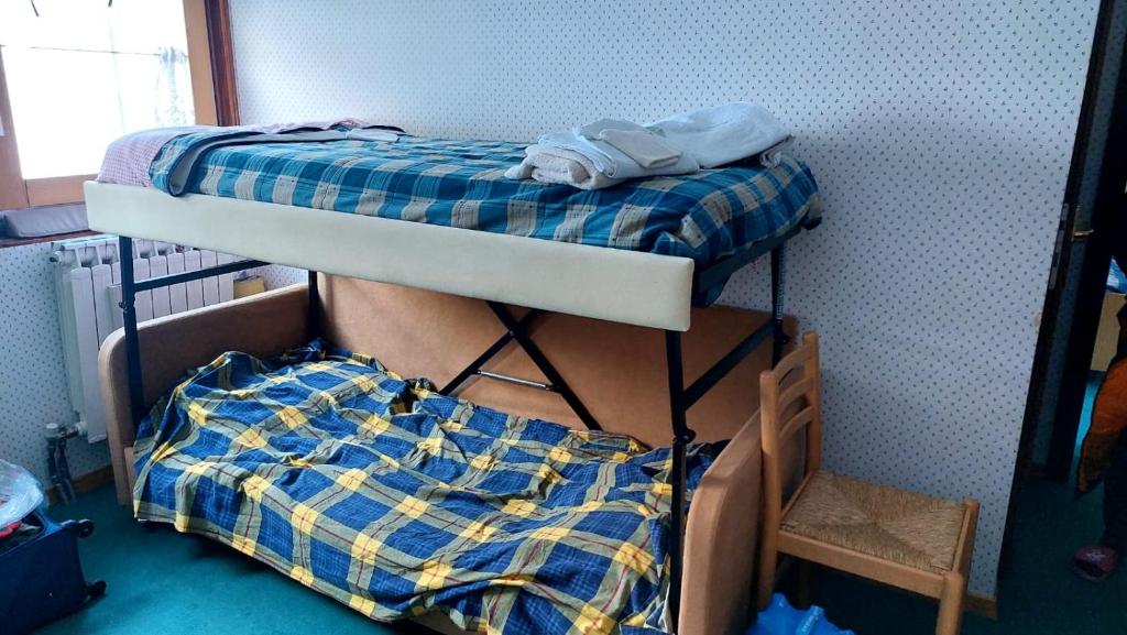 Giường trong phòng chung tại Dolce Vista