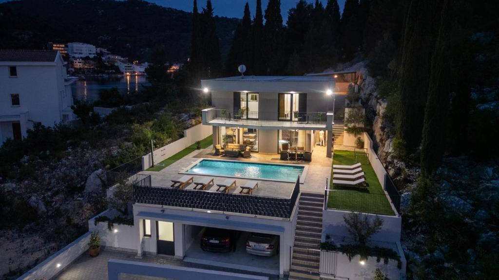 an aerial view of a house with a swimming pool at Villa Juma by Villas Guide in Blace