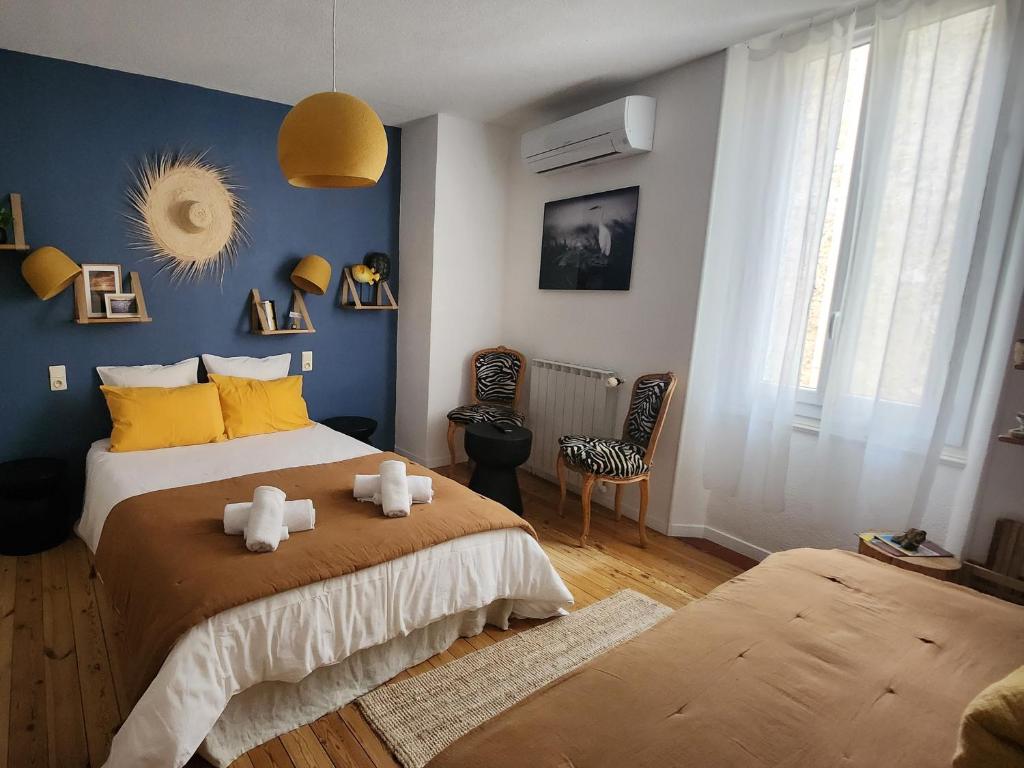 En eller flere senge i et værelse på Chambres d'Hôtes et Gîtes- L'Abri sous Roche