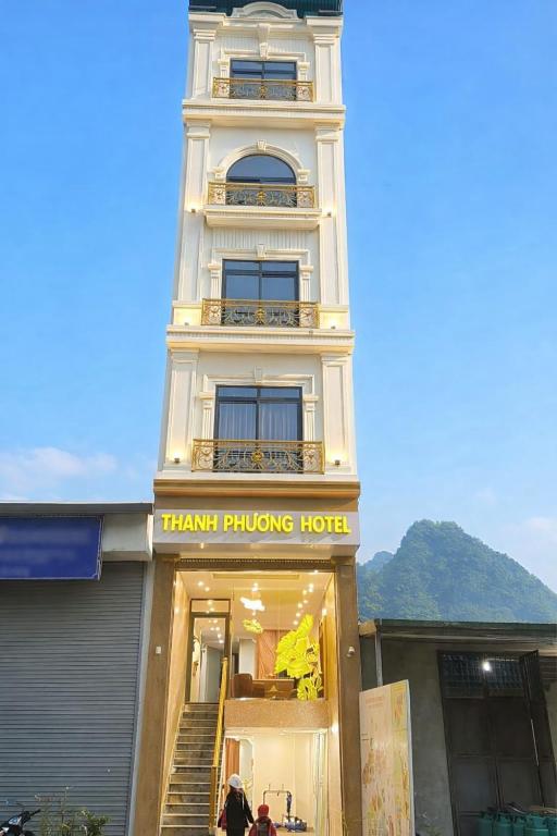 a tall white building with ahmara purchasing hotel at Hotel Thanh Phương 1 in Mèo Vạc