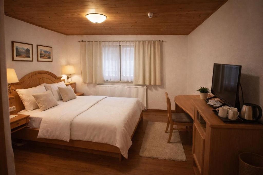 En eller flere senge i et værelse på JOHN'S Pension