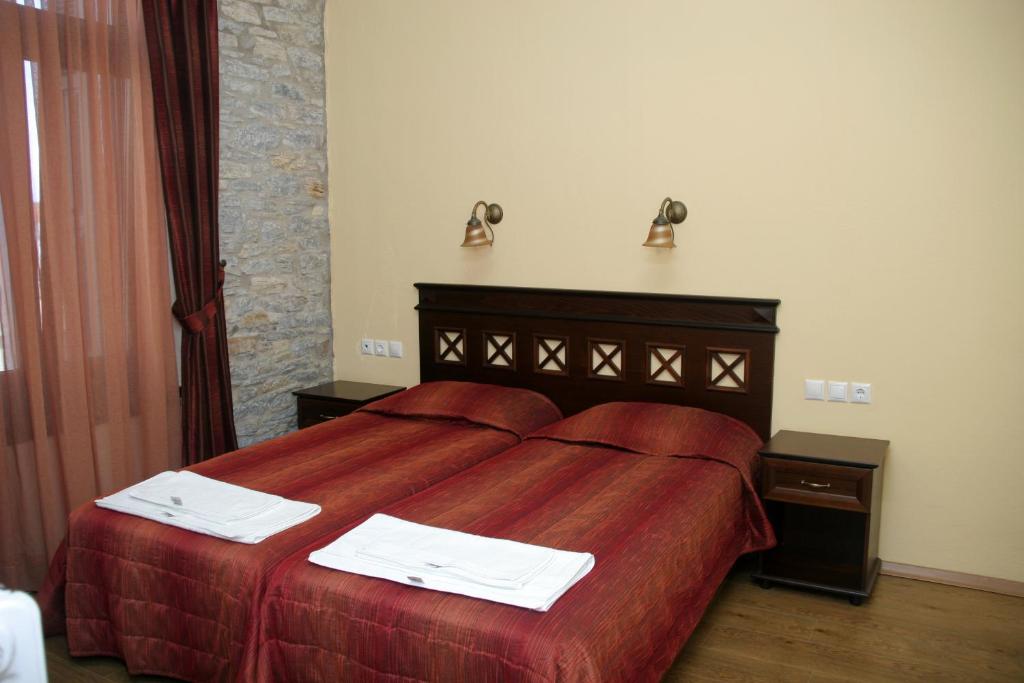 Postel nebo postele na pokoji v ubytování Guesthouse Aktaion