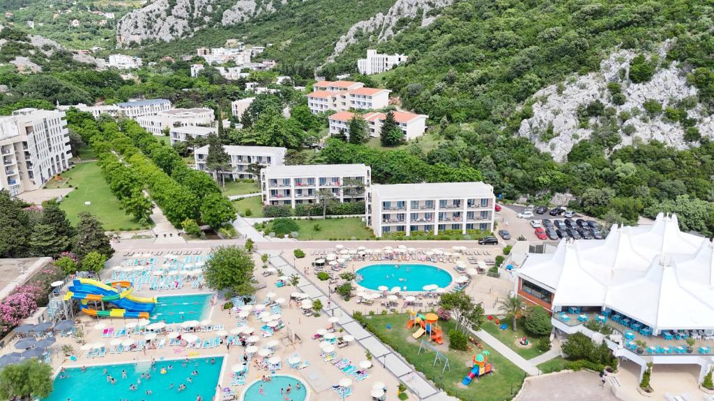 an aerial view of a resort with a swimming pool at Hotel SPICH - Pearl Beach Resort in Čanj