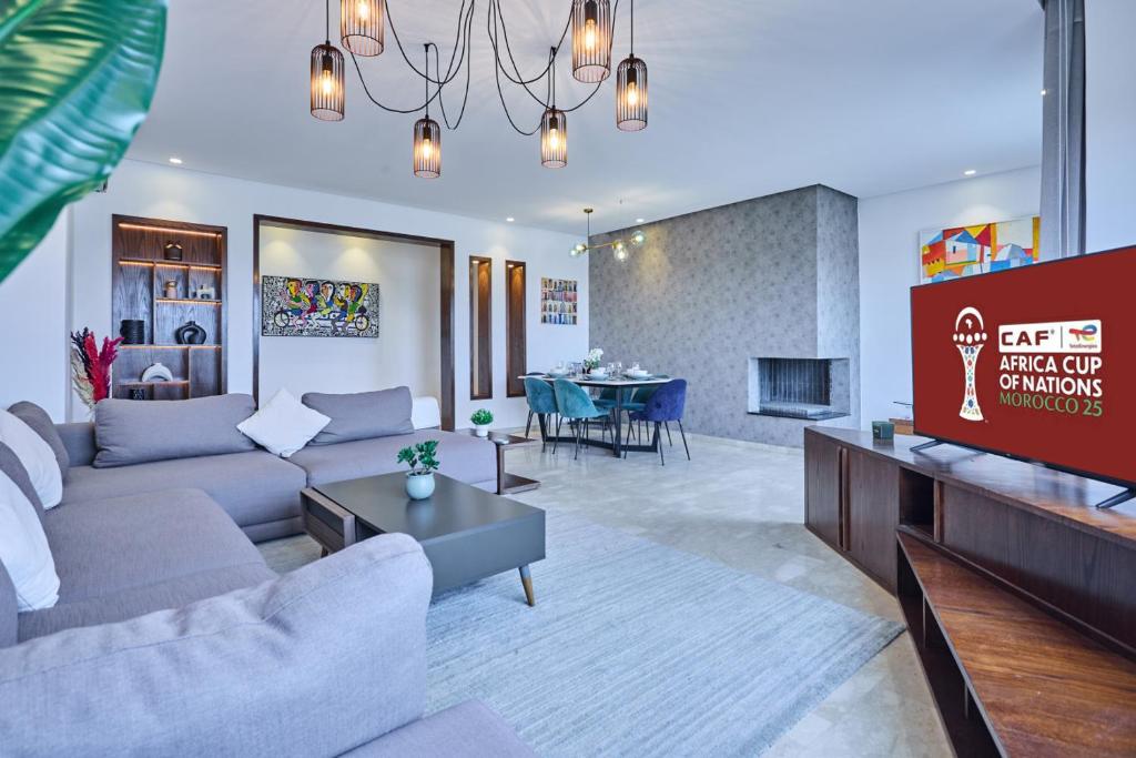 a living room with a couch and a table at Spacious 3BR 174m2 Quiet Residential Casablanca in Casablanca