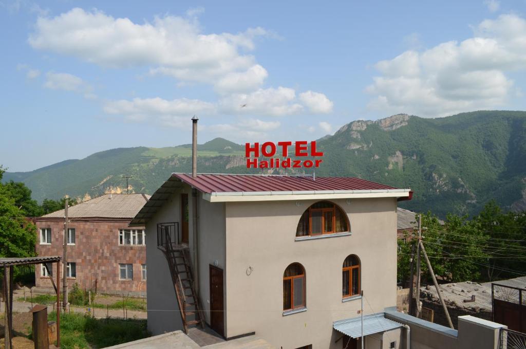 a hotel hilton sign on top of a building at Hotel Halidzor in Halidzor