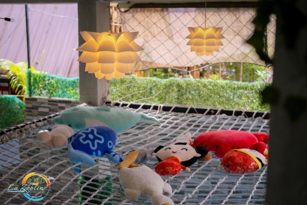 a group of stuffed animals sitting on a table at La Zeblin Beach House in Zambales