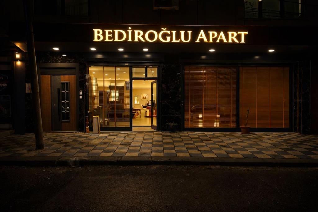 a building with a sign that reads beebocu appartment at Bediroğlu apart in Arnavutköy