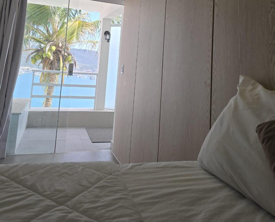 Een bed of bedden in een kamer bij Pousada Atalaia Boutique FR