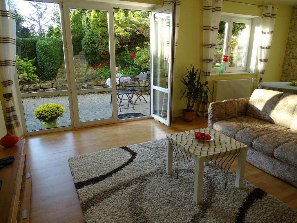 a living room with a couch and a table at Ferienwohnung findus in Haldenwang