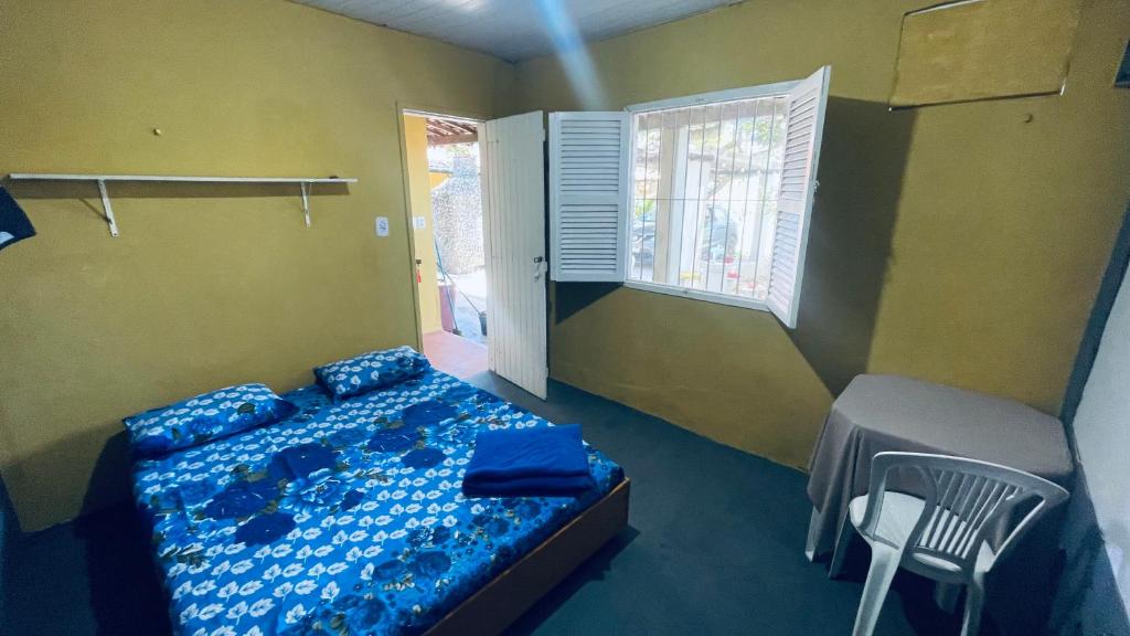 Giường trong phòng chung tại El Gringo Banheiro privativo