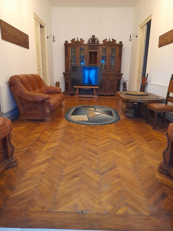 a living room with a couch and a tv at Cazare Craiova Părului 11 in Craiova
