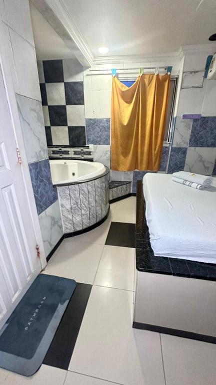 En eller flere senge i et værelse på Hotel Chalex