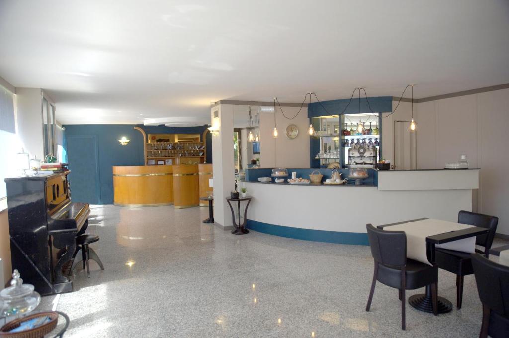 a restaurant with a table and chairs in a room at Hotel Desiderio in Rome