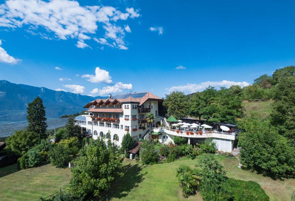 an aerial view of a building on a hill at Hotel Tenz in Montagna