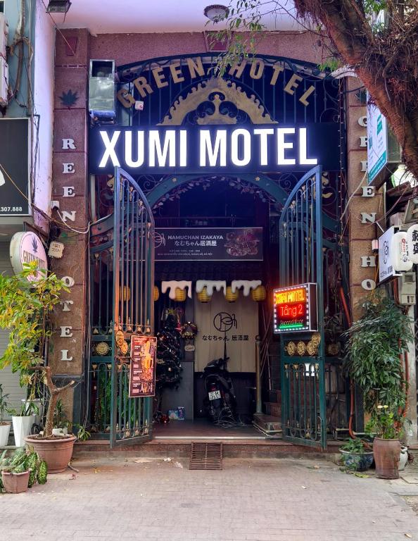 a store with a sign that reads zumini model at Xumi Motel in Hanoi