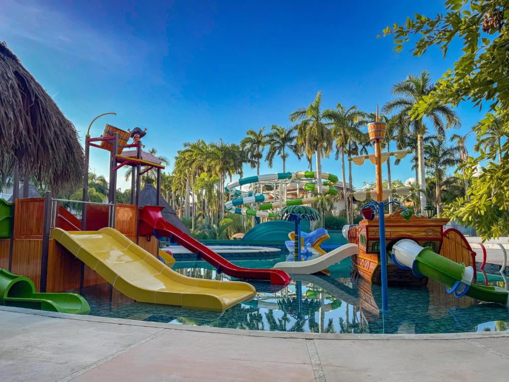 a water park with a water slide and slides at Grand Sunset Princess - All Inclusive in Playa del Carmen