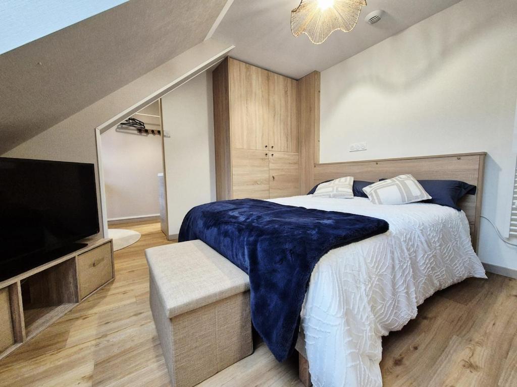 En eller flere senge i et værelse på Studio Ondine