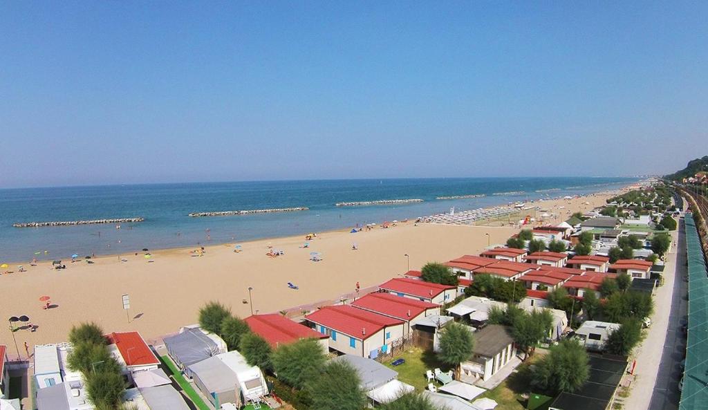 a view of a beach with people on it at Camping Norina in Pesaro