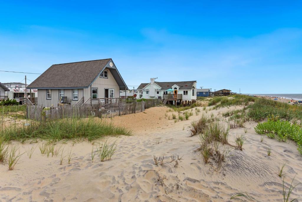 a house on top of a sandy beach at 4060 - Foxhole in Kitty Hawk Beach