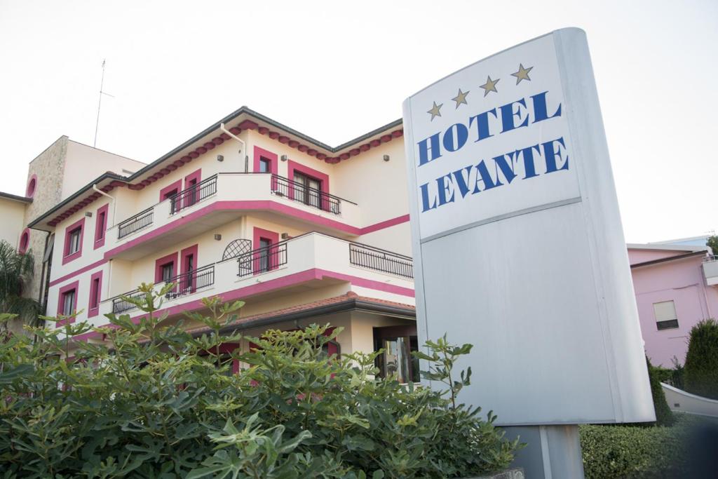 a hotel venue sign in front of a building at Hotel Levante in Fossacesia