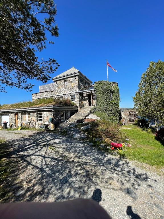 an old stone building with a flag on it at Haven Fortress in Kalven