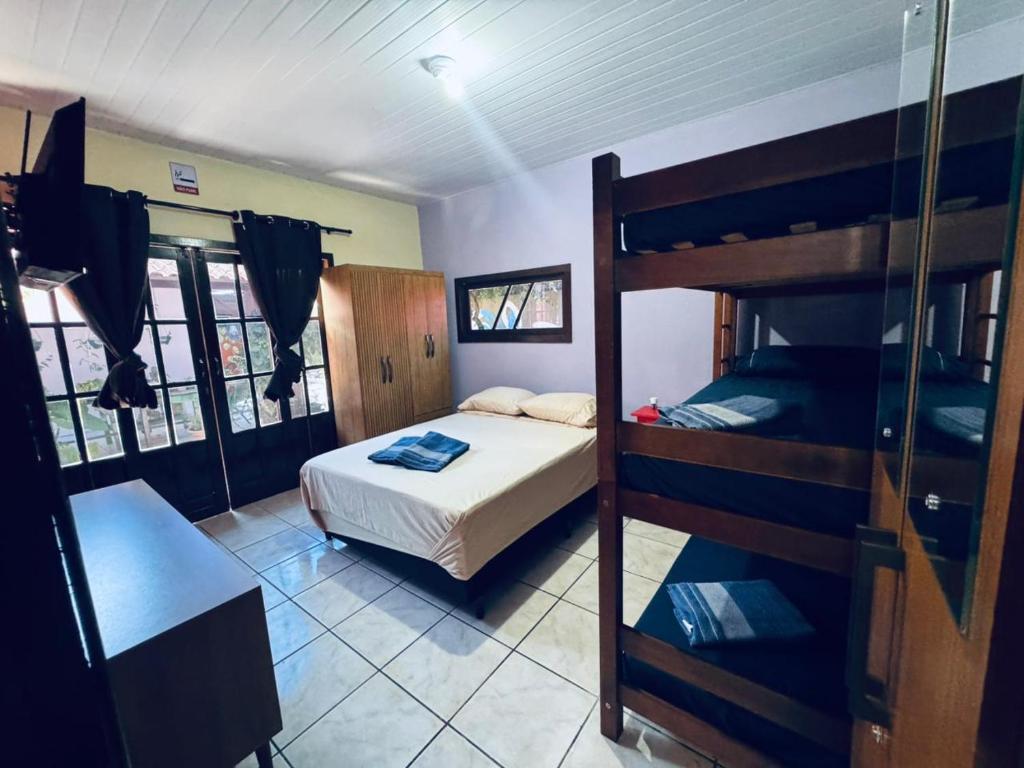 Postel nebo postele na pokoji v ubytování POUSADA DO MILAGRE SAO FRANCISCO DO SUL sc