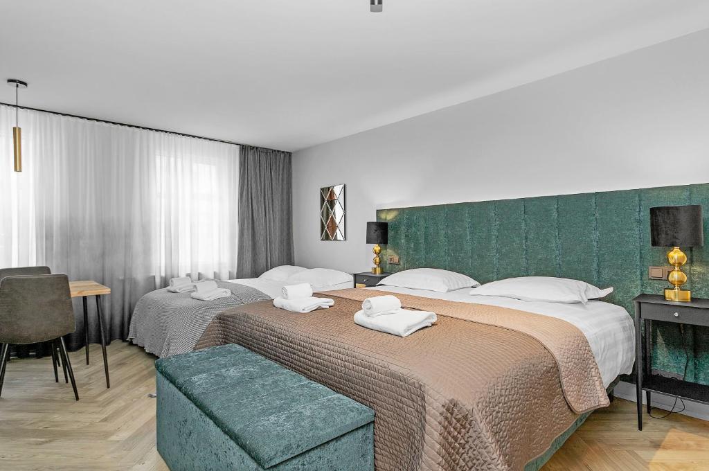 Giường trong phòng chung tại Backyard Apartments by Heimaleiga