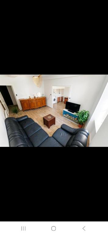 Posezení v ubytování Appartement avec deux chambres et salon de massage