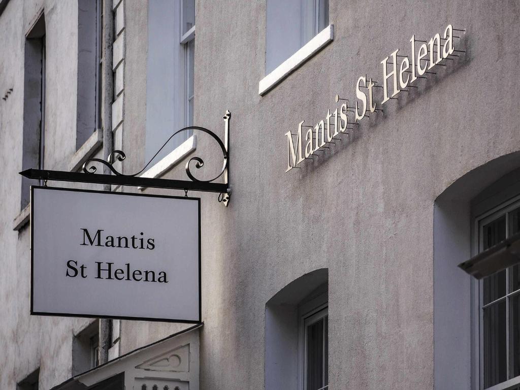 a sign on the side of a building at Mantis St Helena in Jamestown