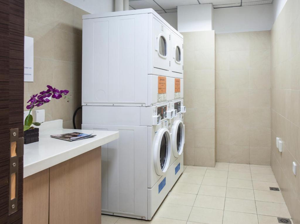 Kuchyň nebo kuchyňský kout v ubytování Citadines Zhuankou Wuhan