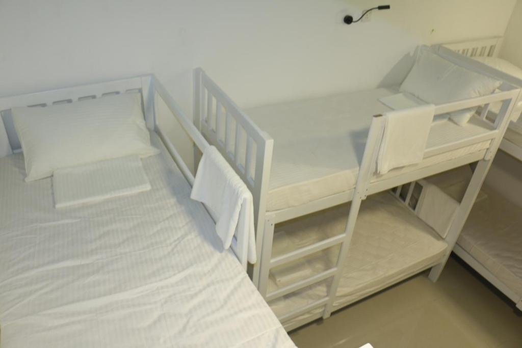 Postel nebo postele na pokoji v ubytování Villa 92 City Stay
