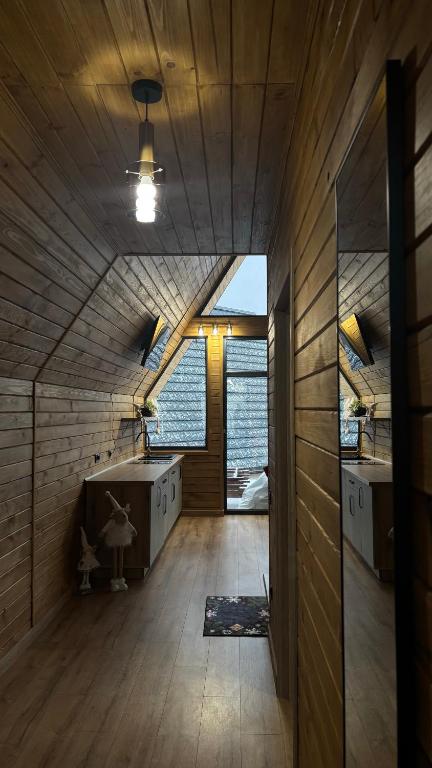 a bathroom with a tub and two sinks and a window at Torino Resort & Spa in Dragonya