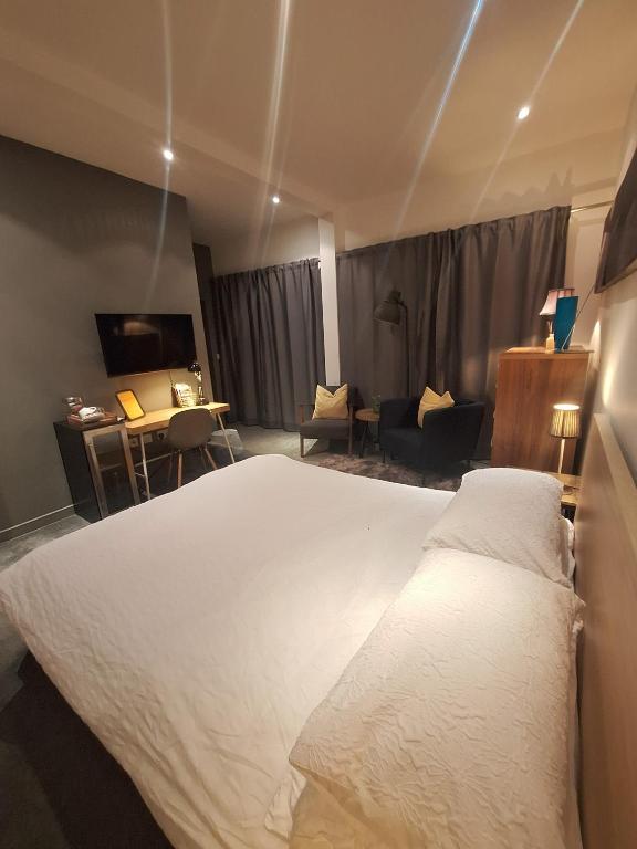 a bedroom with a large white bed in a room at the icecream factory, room in private house in York