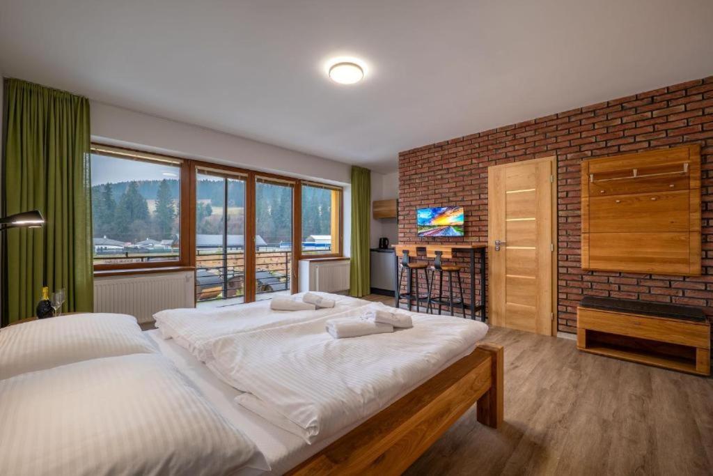En eller flere senge i et værelse på Apartmán Pohoda Liptov