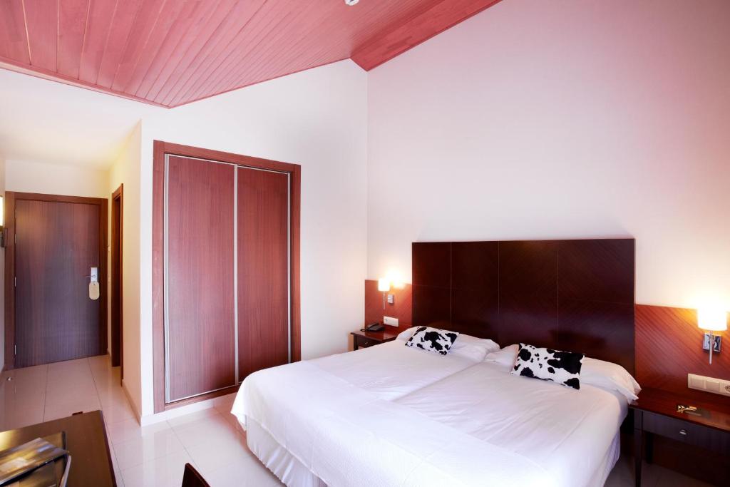 Postel nebo postele na pokoji v ubytování Hotel MU