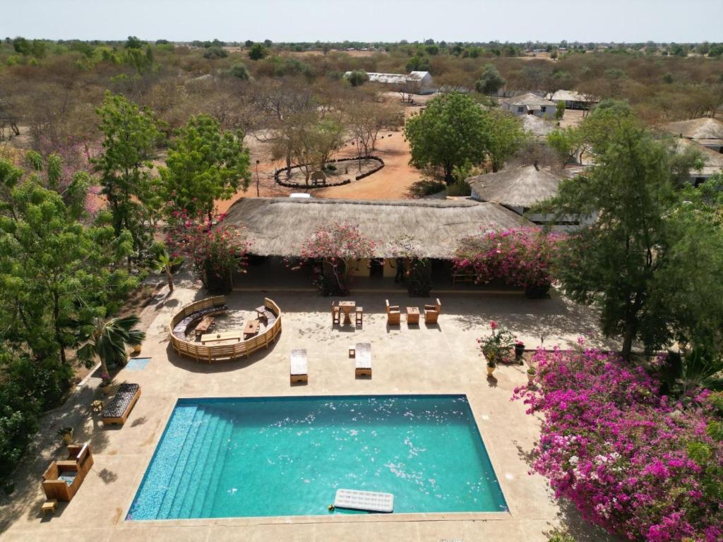 an overhead view of a swimming pool at a resort at Kabacoto Lodges in Darou Rhamane