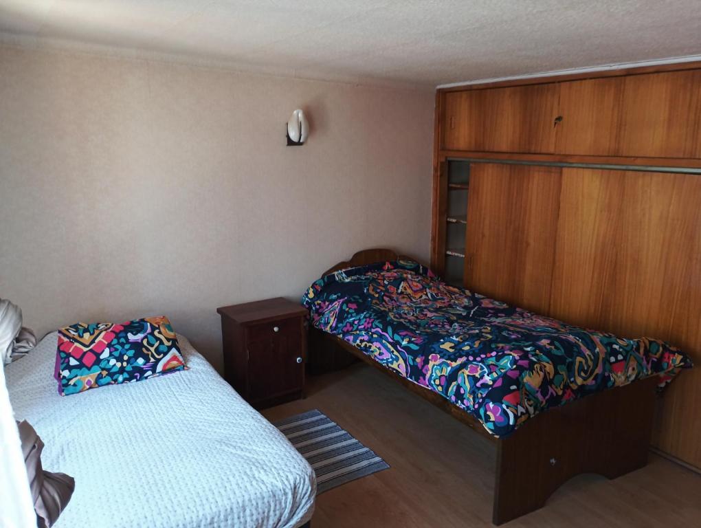 Postel nebo postele na pokoji v ubytování Alojamiento departamentito Viña del mar Chile Casa Segundo piso en arriendo completo