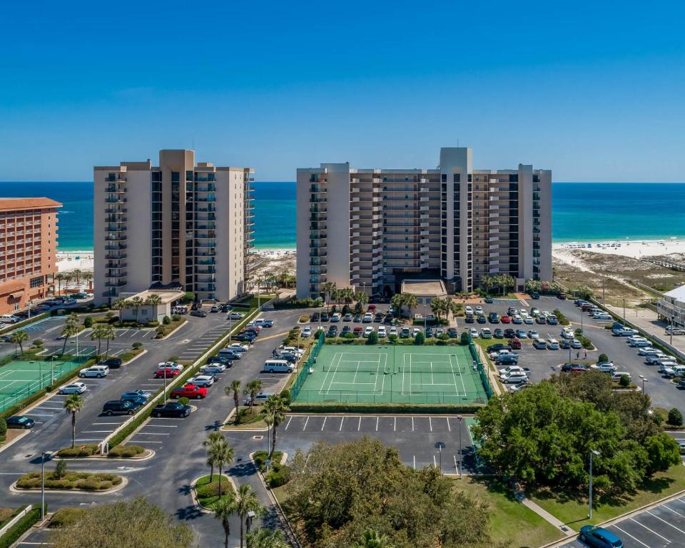 an aerial view of a parking lot with a tennis court at Phoenix East 1401 in Orange Beach