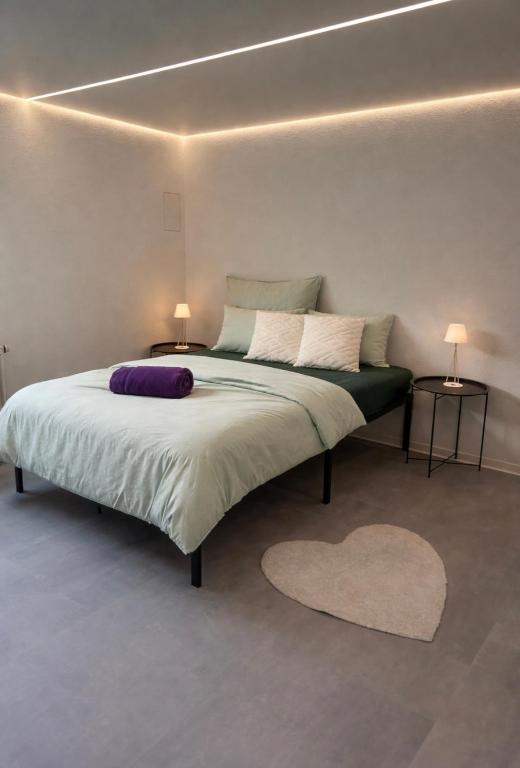 En eller flere senge i et værelse på Modernes ruhiges Appartement mitten in Bad Rappenau mit Frühstück