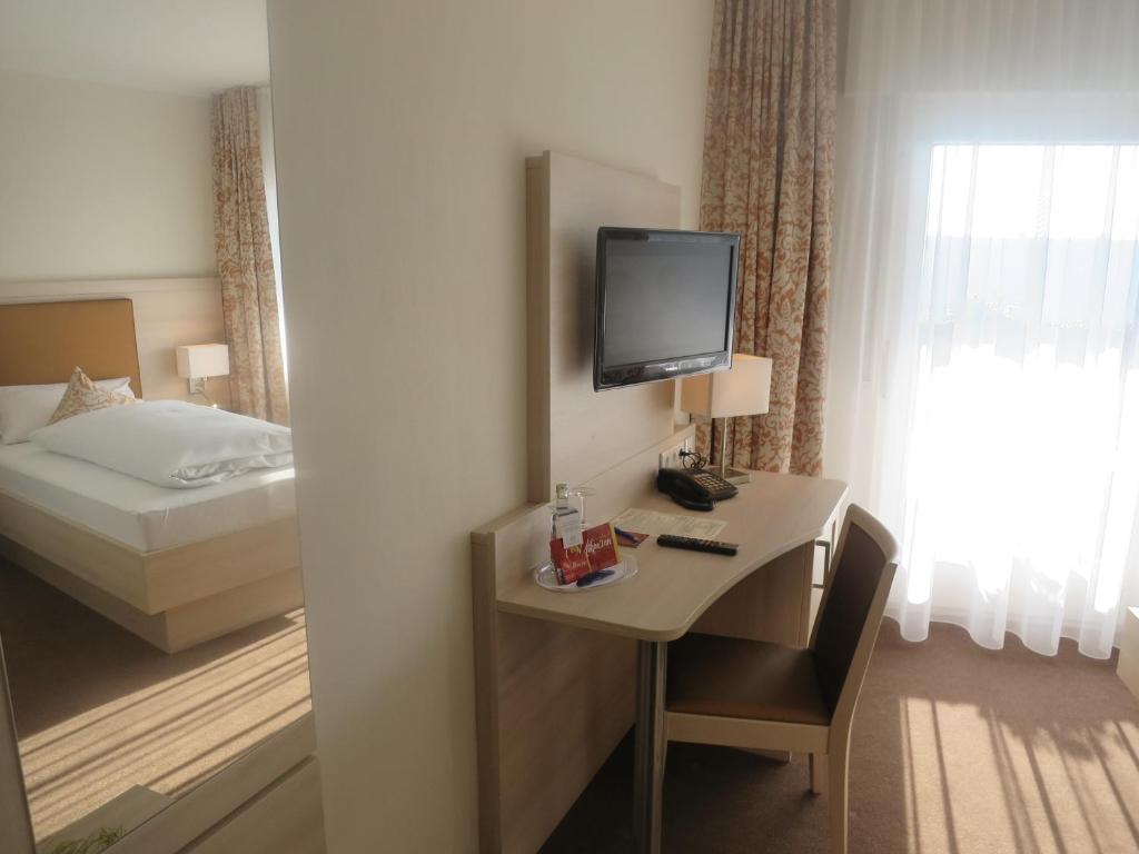 En eller flere senge i et værelse på Gasthof Uthmann