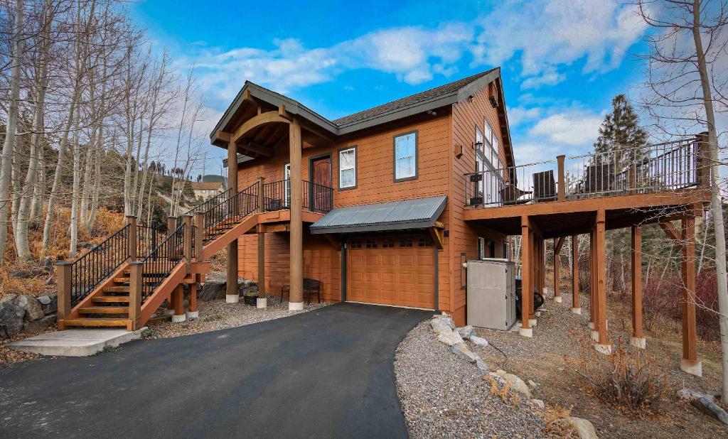 a log home with a large deck and a driveway at Lookout Point - Retreat for 6 in South Lake Tahoe