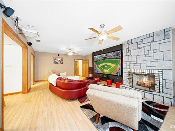 a living room with a fireplace and a tv at Beautiful home in Bridgeview! in Bridgeview
