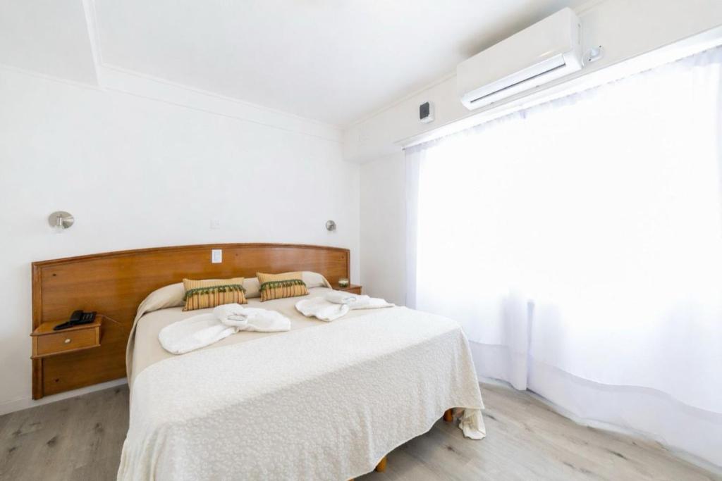 En eller flere senge i et værelse på Hotel España