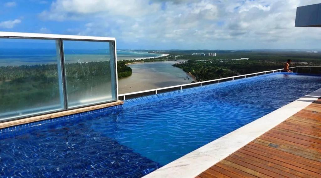 Hồ bơi trong/gần Paiva Home Stay com cama King e cozinha