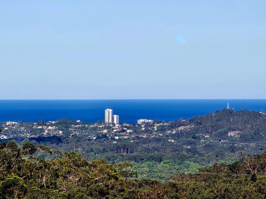 a city on top of a hill next to the ocean at Blue Horizon, Couple's GC Hinterland retreat in Tallebudgera