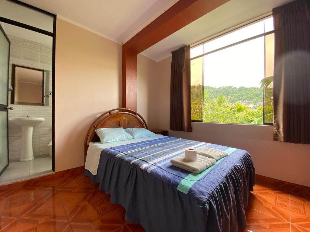 Giường trong phòng chung tại Casa Hospedaje Inkani